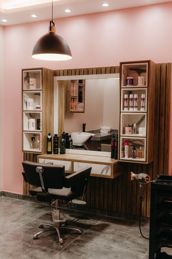 service-04 Stylish barber shop with sleek furniture and ambient lighting for a contemporary grooming experience.